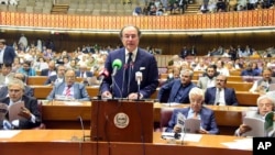 FILE - In this photo released by the Pakistan Finance Ministry Press Service, Pakistan's Finance Minister Muhammad Aurangzeb speaks before the country's National Assembly, in Islamabad, June 12, 2024.