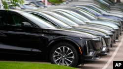 FILE - Vehicles sit in a row outside a dealership in Lone Tree, Colorado, June 2, 2024. CDK Global, a company that provides software for thousands of auto dealers in the U.S. and Canada, was hit by back-to-back cyberattacks on June 19, 2024.