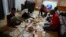 FILE - Mauritanians gather for a traditional meal, July 21, 2023, in Cincinnati.