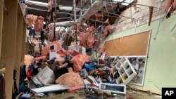 The interior of store is damaged after a severe storm swept through Little Rock, Ark., March 31, 2023. 