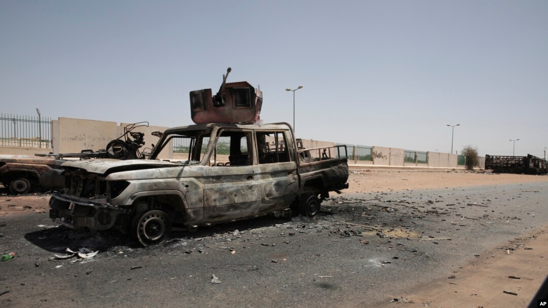 Destroyed military vehicles are seen in southern in Khartoum, Sudan, April 20, 2023. 
