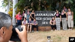 Lahainaluna High School 2024 graduates pose with Downtown Athletic Club of Hawaii President Keith Amemiya, left, after a scholarship presentation July 31, 2024, in Lahaina, Hawaii.