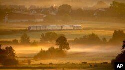 A hydrogen train approaches the station of Wehrheim near Frankfurt, Germany.