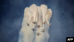 Members of South Korea&#39;s &#39;Black Eagle&#39; aerobatics team perform a display at the Seoul International Aerospace and Defense Exhibition (ADEX) in Seongnam, south of Seoul.