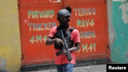 FILE - Police patrol the streets after gang members tried to attack a police station, in Port-au-Prince, Haiti, April 25, 2023. U.N. officials who warn that the country's insecurity is worsening. 