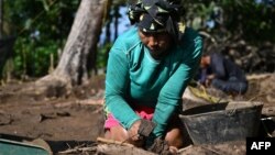 Colombian Indigenous and Afro-descendant archeological assistants work at the Archaeological and Historical Park of Santa Maria de la Antigua del Darien in Unguia, Colombia, in the dense jungle of the Darien near Panama, on Sept. 16, 2023.