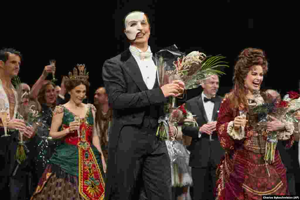 "The Phantom of the Opera" cast appear at the curtain call following the final Broadway performance at the Majestic Theatre, April 16, 2023, in New York. 