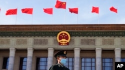 A Chinese soldier stands guard outside the Great Hall of the People after the opening ceremony of The Third Belt and Road Forum in Beijing, Oct. 18, 2023. (AP Photo/Ng Han Guan)