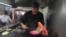 Newly minted Michelin-starred chef Arturo Rivera Martínez prepares an order of tacos at the Tacos El Califa de León taco stand in Mexico City, May 15, 2024.