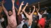 Supporters of Pakistan's former Prime Minister Imran Khan celebrate in Multan, Pakistan, May 11, 2023, after the Supreme Court's decision to release Khan, whose arrest sparked a wave of violence across the country by his supporters. (AP Photo/Asim Tanveer)