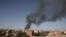 FILE - Smoke is seen in Khartoum, Sudan, April 19, 2023. Warring factions trying to seize control of the east African nation of Sudan have plunged the country into chaos. 