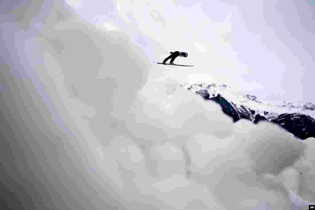 Remo Imhof of Switzerland soars through the air during his trial jump at the third stage of the 72th Four Hills ski jumping tournament in Innsbruck, Austria.