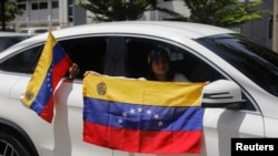 Venezuelans living in El Salvador take part in a protest against the election results that awarded Venezuelan President Nicolas Maduro a third term, at the U.N. offices in San Salvador, El Salvador, July 31, 2024.