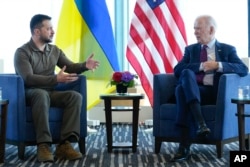 President Joe Biden, right, meets with Ukrainian President Volodymyr Zelenskyy on the sidelines of the G7 Summit in Hiroshima, Japan, Sunday, May 21, 2023. (AP Photo/Susan Walsh)