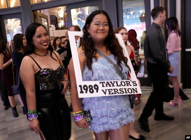 Karen Boncan, left, and Petrushka Seville arrive at the world premiere of the concert film "Taylor Swift: The Eras Tour" on Wednesday, Oct. 11, 2023, at AMC The Grove 14 in Los Angeles. (AP Photo/Chris Pizzello)