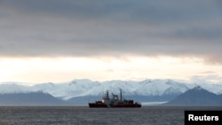 FILE - The Canadian Coast Guard ship Des Groseilliers is seen near the arctic community of Pond Inlet, Nunavut, Aug. 23, 2014.