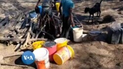 Villagers Drawing Water from Drying Well