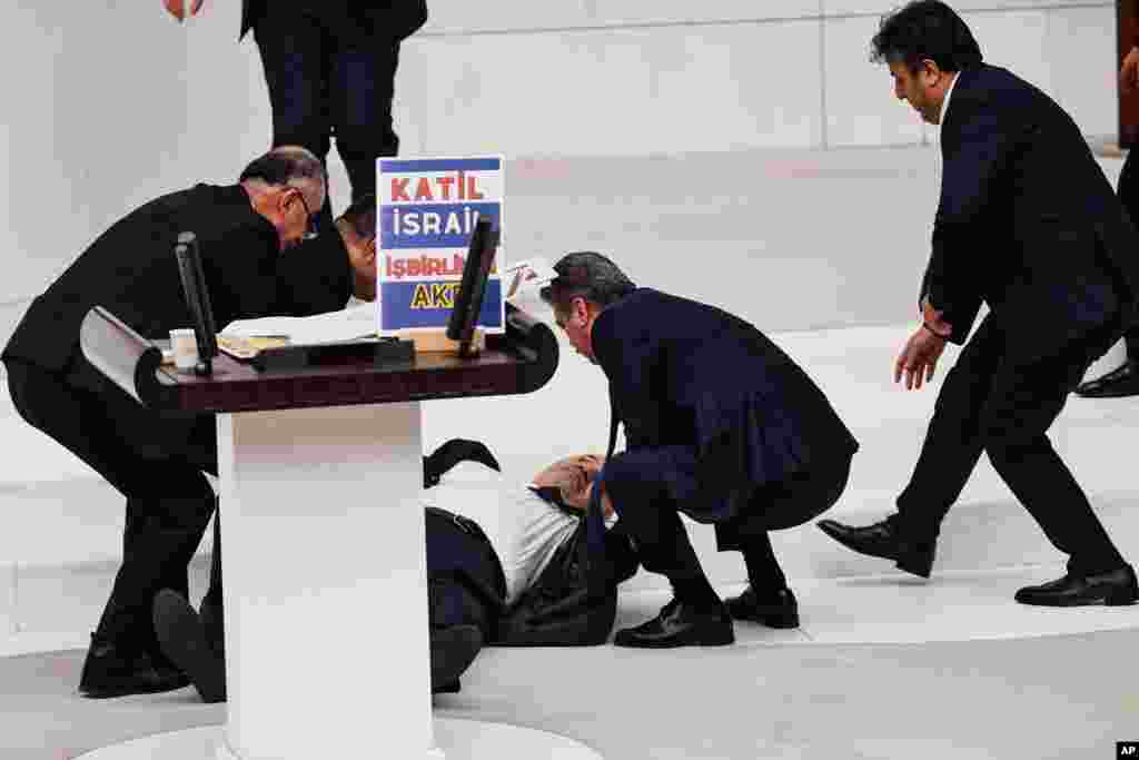 Hasan Bitmez, a Turkish lawmaker from the Islamist Saadet Partisi, or Felicity Party, collapses after speaking at the main chamber of the Turkish parliament in Ankara.