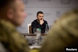 Ukraine's President Volodymyr Zelenskyy attends a meeting with top military officials as he visits the Kharkiv region, May 16, 2024 in this handout image. (Ukrainian Presidential Press Service/Handout via Reuters)