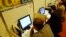 FILE - People use the internet during an internet governance forum in Rio de Janeiro, Brazil, Nov. 12, 2007.