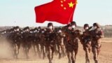 China depicts NATO as peace-threatening alliance while holding military drills on member's border.