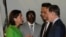 US Commerce Secretary Gina Raimondo, chats with Lin Feng, director general of China Ministry of Commerce, and US Ambassador to China Nick Burns, upon her arrival at the Beijing Capital International Airport, Aug. 27, 2023. (Andy Wong/Pool via Reuters) 