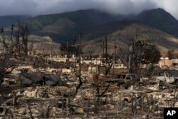 FILE - A general view shows the aftermath of a wildfire in Lahaina, Hawaii, Aug. 21, 2023.