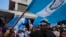 People march against legal actions taken by the Attorney General's office against the Seed Movement party and President-Elect Bernardo Arévalo, in Guatemala City, Sept. 2, 2023. 