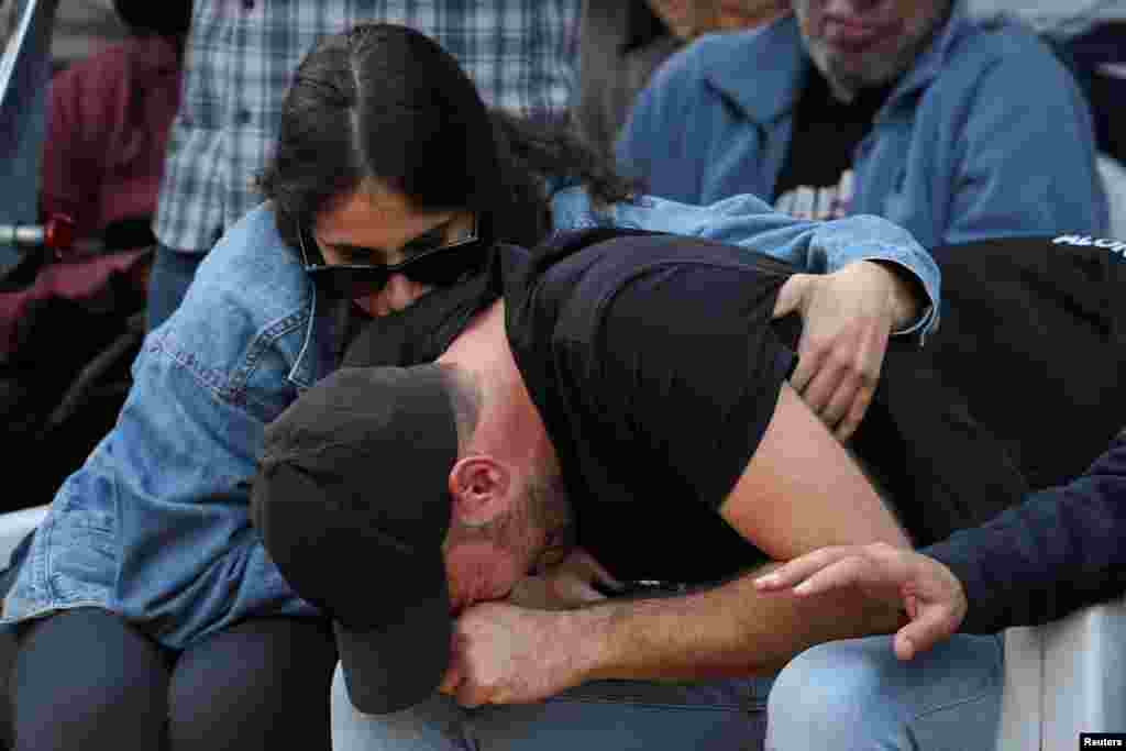 Ido, brother of Alon Lulu Shamriz, one of three Israeli hostages who were mistakenly killed by the Israeli military while being held hostage in Gaza by the Palestinian Islamist group Hamas, reacts at the funeral in Shefayim, Israel.