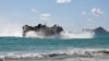 A Japan Maritime Self Defense Force landing craft air cushion prepares to land on Bellows Beach during a joint exercise between Japan and the Peruvian navy at the Rim of the Pacific (RIMPAC) military exercises in Waimanalo, Hawaii, July 18, 2024.