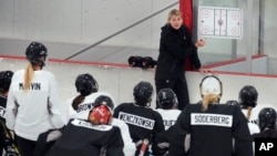 FILE - Courtney Kessel, head coach of the Boston-based team of the Professional Women's Hockey League, instructs her players during a team hockey practice on Nov. 20, 2023, in Wellesley, Massachusetts. The new six-team league began play on Jan. 1, 2024. 