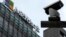 FILE - A security surveillance camera is seen near the Microsoft office building in Beijing, July 20, 2021. Microsoft said Wednesday that state-backed Chinese hackers have been targeting U.S. critical infrastructure for the potential disruption of critical communications.