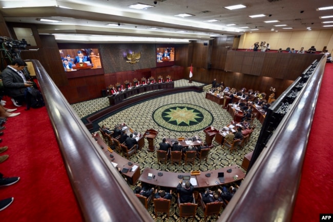 Sidang tanggapan Komisi Pemilihan Umum (KPU) terhadap perselisihan hasil pemilu di Mahkamah Konstitusi, 28 Maret 2024. (BAY ISMOYO/AFP)