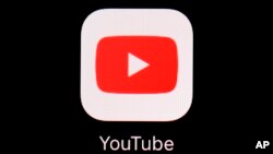 FILE - The YouTube app displayed on an iPad in Baltimore on March 20, 2018. 