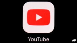 FILE - The YouTube app is displayed on an iPad in Baltimore on March 20, 2018. 