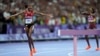 Winfred Yavi of Bahrain celebrates winning the gold medal in the women's 3,000 steeplechase at the 2024 Summer Olympics, Aug. 6, 2024, in Paris. Yavi is Kenyan but has competed for Bahrain since 2014. 