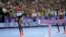 Winfred Yavi of Bahrain celebrates winning the gold medal in the women's 3,000 steeplechase at the 2024 Summer Olympics, Aug. 6, 2024, in Paris. Yavi is Kenyan but has competed for Bahrain since 2014. 