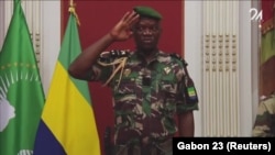 A screen grab of Gen. Brice Oligui Nguema standing at attention while singing the national anthem. The Gabon junta named Gen. Nguema as transition leader, soldiers said on national television August 30, 2023.