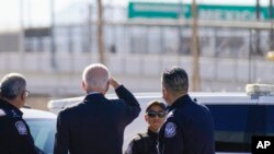 FILE - President Joe Biden looks towards a large 'Welcome to Mexico' sign over the Bridge of the Americas as he tours the El Paso port of entry, a busy port of entry along the US-Mexico border, in El Paso Texas, Jan. 8, 2023.