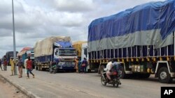 Stranded trucks with goods are seen at the border between Nigeria and Niger in Jibia, Nigeria, on Aug. 7, 2023.