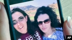 FILE - In this 2018 selfie provided by Emma Tsurkov, right, she and her sister Elizabeth Tsurkov pose while in Santa Clara Valley, California. Elizabeth Tsurkov, a Russian-Israeli academic at Princeton University, went missing in Iraq in March of 2023.
