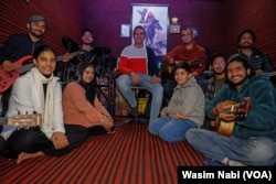 The duo of Irfan and Bilal provide training to dozens of youth inside their studio using modern musical instruments.