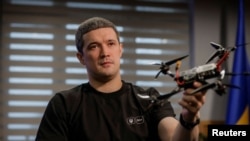 Ukrainian Digital Transformation Minister Mykhailo Fedorov holds a drone in Kyiv on Sept. 15, 2023, as he explains that Ukrainian drone production has increased by more than 100 times since last year.