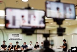 FILE - Representatives of Hong Kong media organizations attend a press conference in Hong Kong, Sept. 24, 2020.