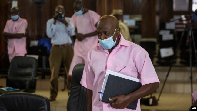 FILE - Paul Rusesabagina, who inspired the film 'Hotel Rwanda' and is credited with saving more than 1,000 people by sheltering them at the hotel he managed during the genocide, attends a court hearing in Kigali, Rwanda, Feb. 26, 2021.