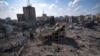 A neighborhood in Gaza City hit by an Israeli airstrike lies in rubble, Tuesday, Oct. 10, 2023. 