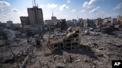 A neighborhood in Gaza City hit by an Israeli airstrike lies in rubble, Tuesday, Oct. 10, 2023. 