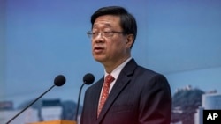 Hong Kong Chief Executive John Lee speaks during a news conference in Hong Kong, March 21, 2023. 