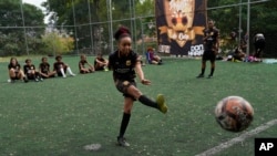 Agatha strikes a ball during a football training session run by the Bola de Ouro social program, at the Complexo da Alemao favela in Rio de Janeiro, Brazil, May 16, 2024.