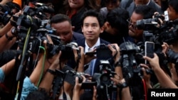 Former Move Forward party leader Pita Limjaroenrat arrives at the party headquarters after Thailand's Constitutional Court delivered its verdict on a case seeking the dissolution of the opposition group over its call for lese-majeste reform, in Bangkok, Aug. 7, 2024.